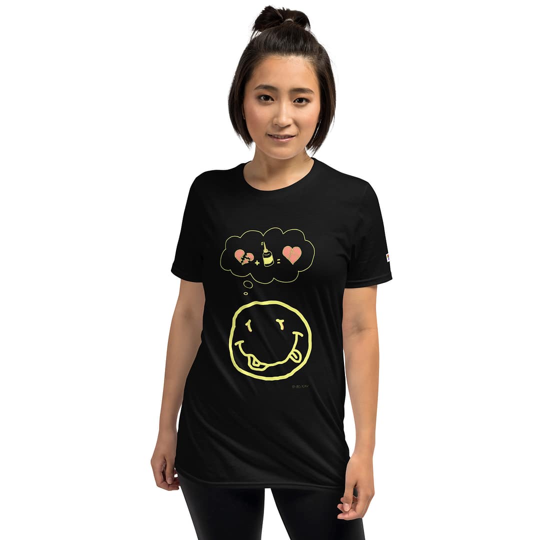 Asian girl in a black navy blue colored daddy grunge cartoon shirt with the altered Nirvana smiley and the thought bubble with the glued together heart pieces as a motive.