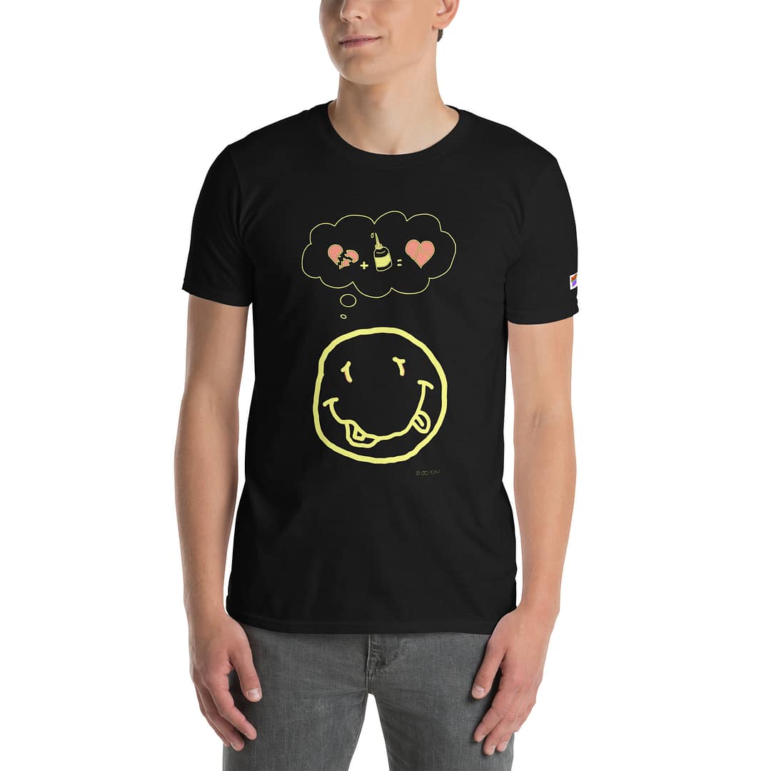 Caucassian guy in a black daddy grunge cartoon shirt with the altered Nirvana smiley and the thought bubble with the glued together heart pieces as a motive. Face is halfway cut off.
