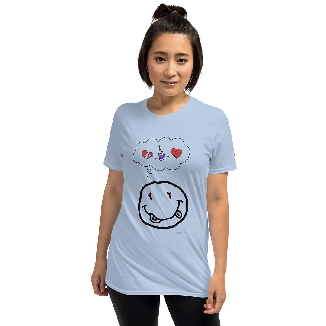Asian girl in a light blue daddy grunge cartoon shirt with the altered Nirvana smiley and the thought bubble with the glued together heart pieces as a motive.