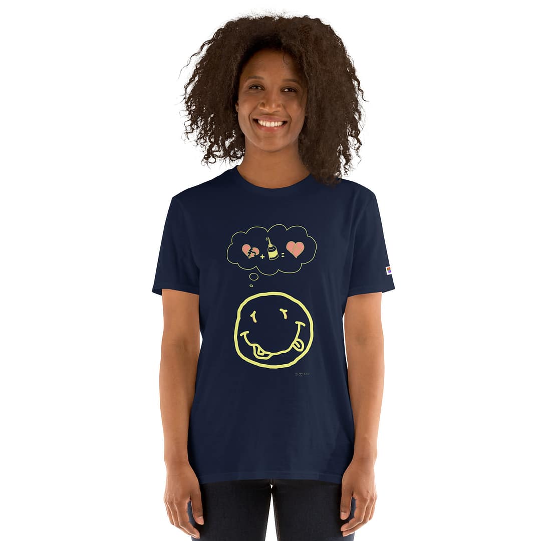 Dark-skinned girl in a dark navy blue daddy grunge cartoon shirt with the altered Nirvana smiley and the thought bubble with the glued together heart pieces as a motive.