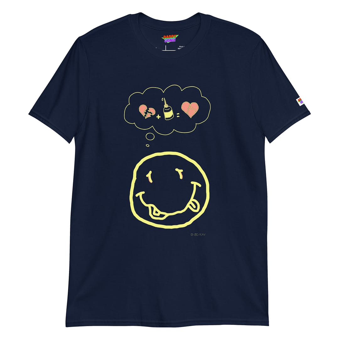 Picture with a dark navy blue colored shirt with a cartoonish yellow smiley resembling the Nirvana smiley who has a a thought bubble showing a broken heart with a glue squeeze bottle which connects the broken pieces to a repaired heart with the pieces glued together
