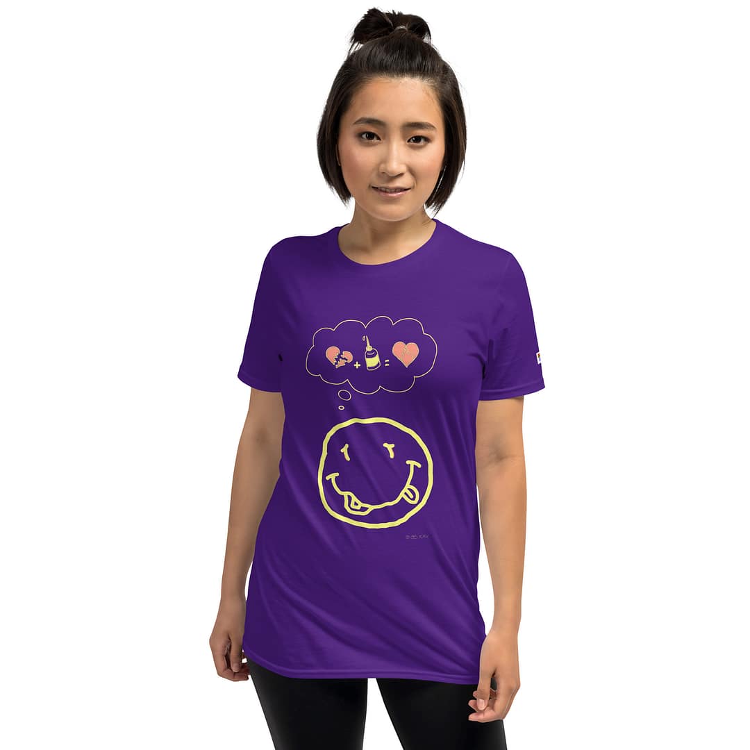Asian girl in a purple daddy grunge cartoon shirt with the altered Nirvana smiley and the thought bubble with the glued together heart pieces as a motive.
