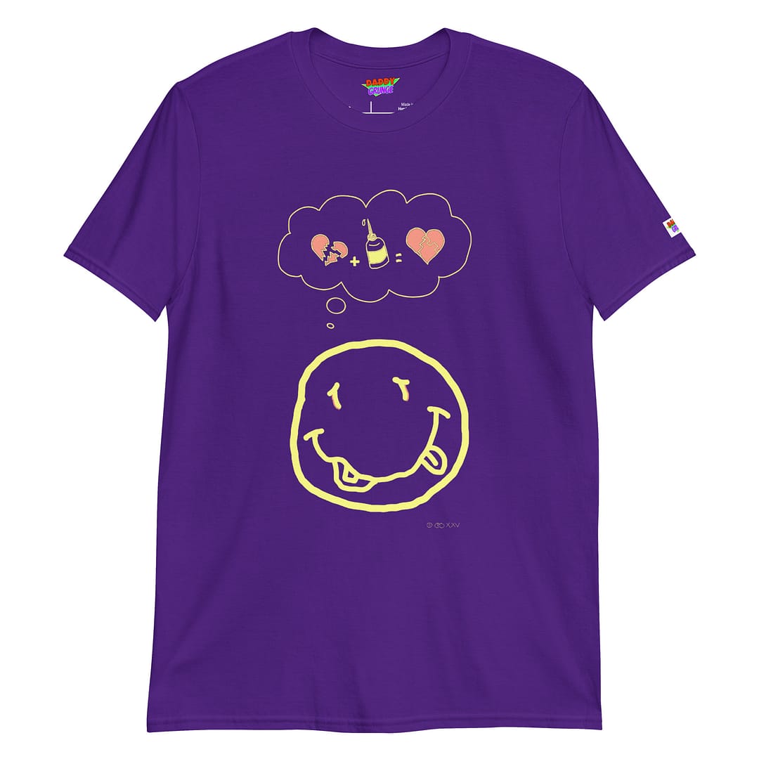 Picture with a purple colored shirt with a cartoonish yellow smiley resembling the Nirvana smiley who has a a thought bubble showing a broken heart with a glue squeeze bottle which connects the broken pieces to a repaired heart with the pieces glued together