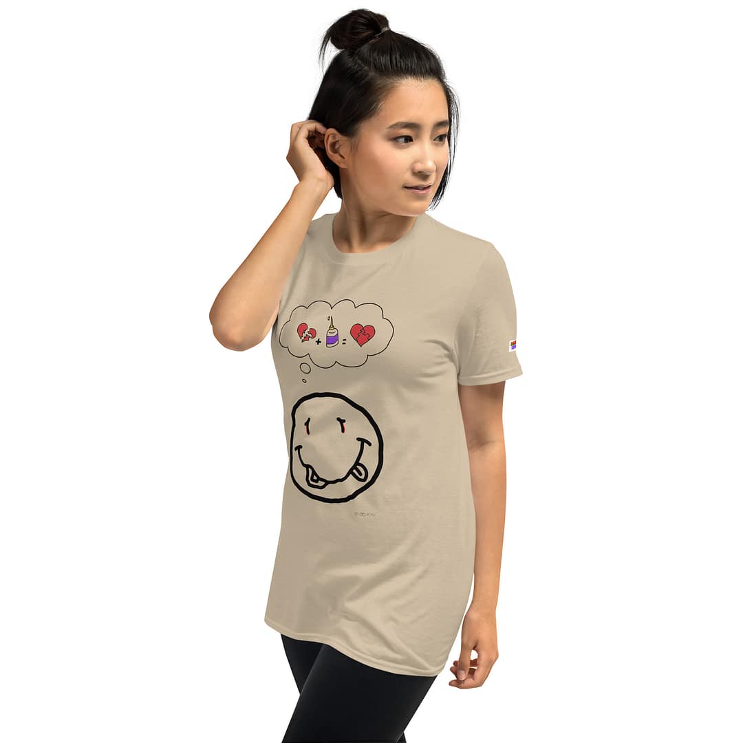 Asian girl in a sand colored daddy grunge cartoon shirt with the altered Nirvana smiley and the thought bubble with the glued together heart pieces as a motive.