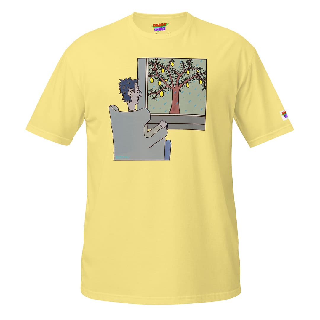 Bright yellow T-shirt showing a cartoon of a moody guy sitting in a chair and looking out into the gloomy, rainy weather where outside a tree with lemons stands.