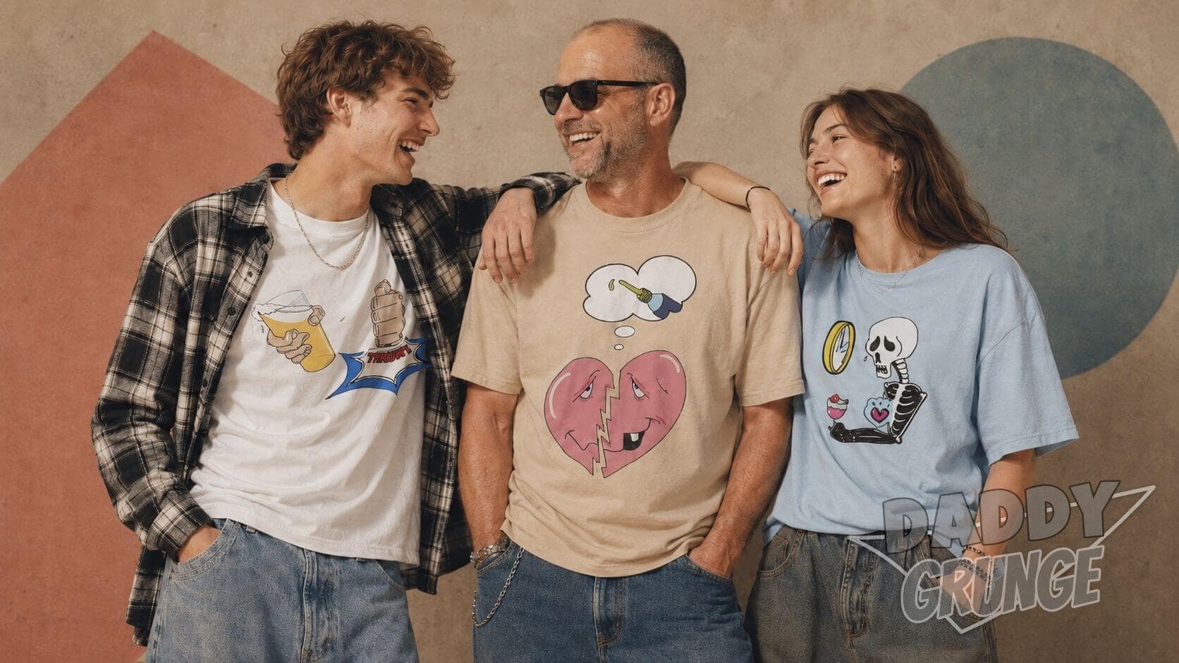 Hero picture on the front-page showing three individuals, one older mid40s guy in the middle with sunglasses wearing the sand-colored Daddy Grunge shirt "Maybe Just Happy" and a younger Gen-Z boy in a flannel shirt over the white "Get-Up-Again" motif of Daddy Grunge leaning on him on the left side. On the right-hand side of the supposedly cool dad is a teenage or twen GenZ girl wearing a light blue shirt with the "Wrote Her Off" motif. In the bottom right is the logo of Daddy Grunge brand.